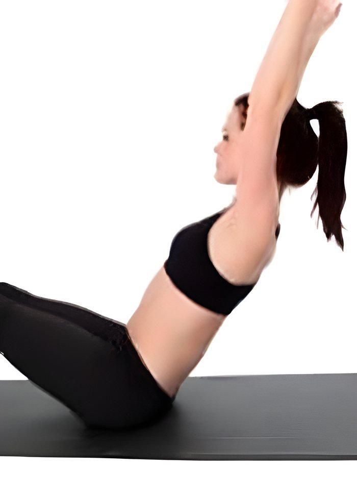 A Pilates exercise performed on a mat